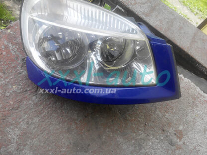 Накладка під фару права Fiat Doblo 735418075